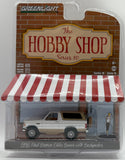 GREENLIGHT 1996 FORD BRONCO EDDIE BAUER WITH BACKPACKER WHITE NEW ON CARD