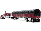 Dcp / First Gear 1/64  Peterbilt Model 389 with 63" Flat Top Sleeper and 53' Wilson Roadbrute Flatbed with Covered Wagon in Maroon and White **60-2058
