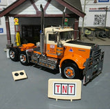 1/50 SCALE ICONIC REPLICAS KENWORTH W900 TNT FREIGHT SERVICES DAY CAB IN PEACHES AND CREAM
