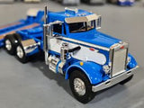 1/64 DCP / FIRST GEAR VINTAGE PETERBILT IN BLUE AND WHITE WITH TRI HEAVY HAULER TRAILER 60-1252