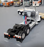 1/64 DCP / FIRST GEAR PETERBILT 379 WHITE WITH EXTENDABLE DROP DECK TRI AXLE TRAILER