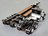 1/64 DCP / FIRST GEAR VINTAGE PETERBILT IN BLACK AND WHITE WITH TRI HEAVY HAULER TRAILER 60-1256